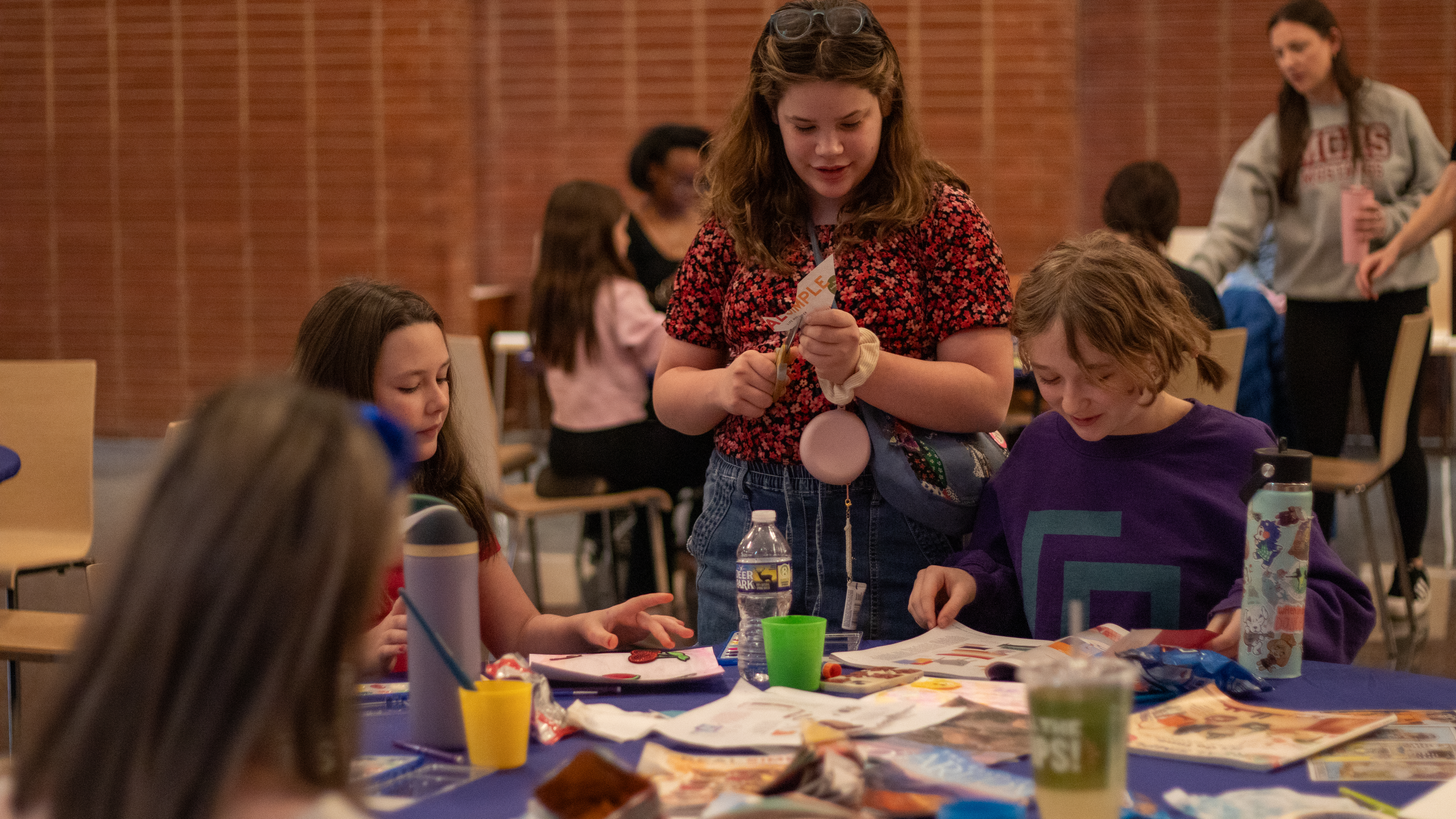 Teens enjoying a craft afternoon making vision boards.