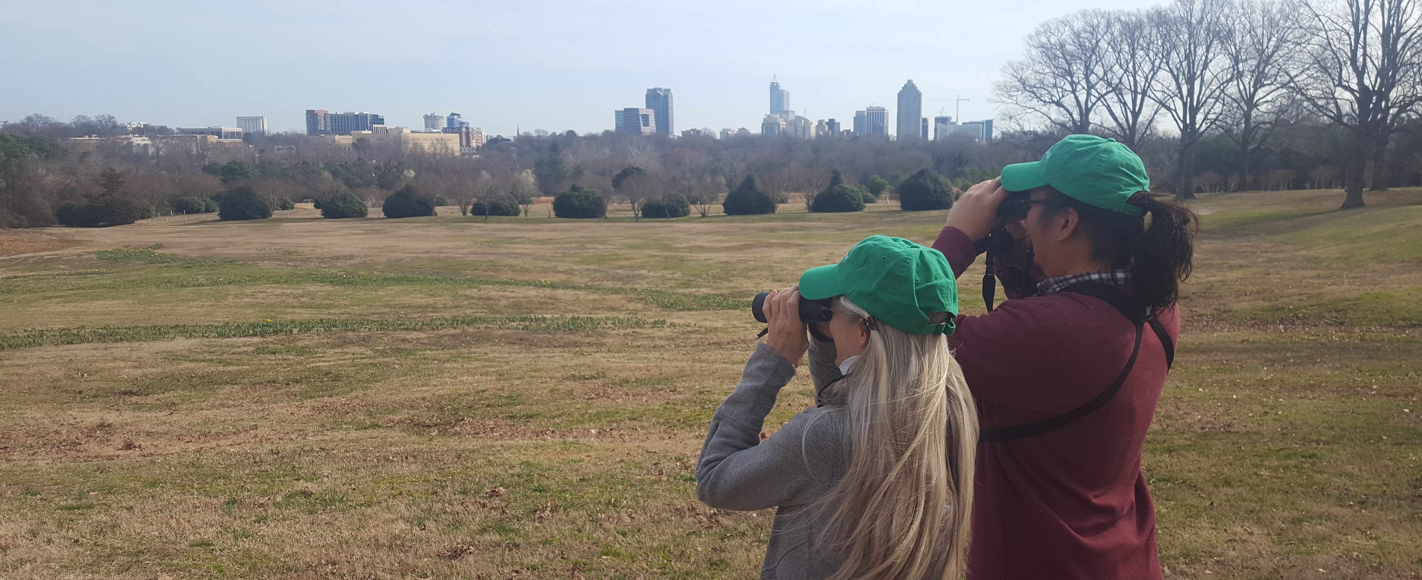 A man and a woman with binoculars Bird Watching at Dix Park