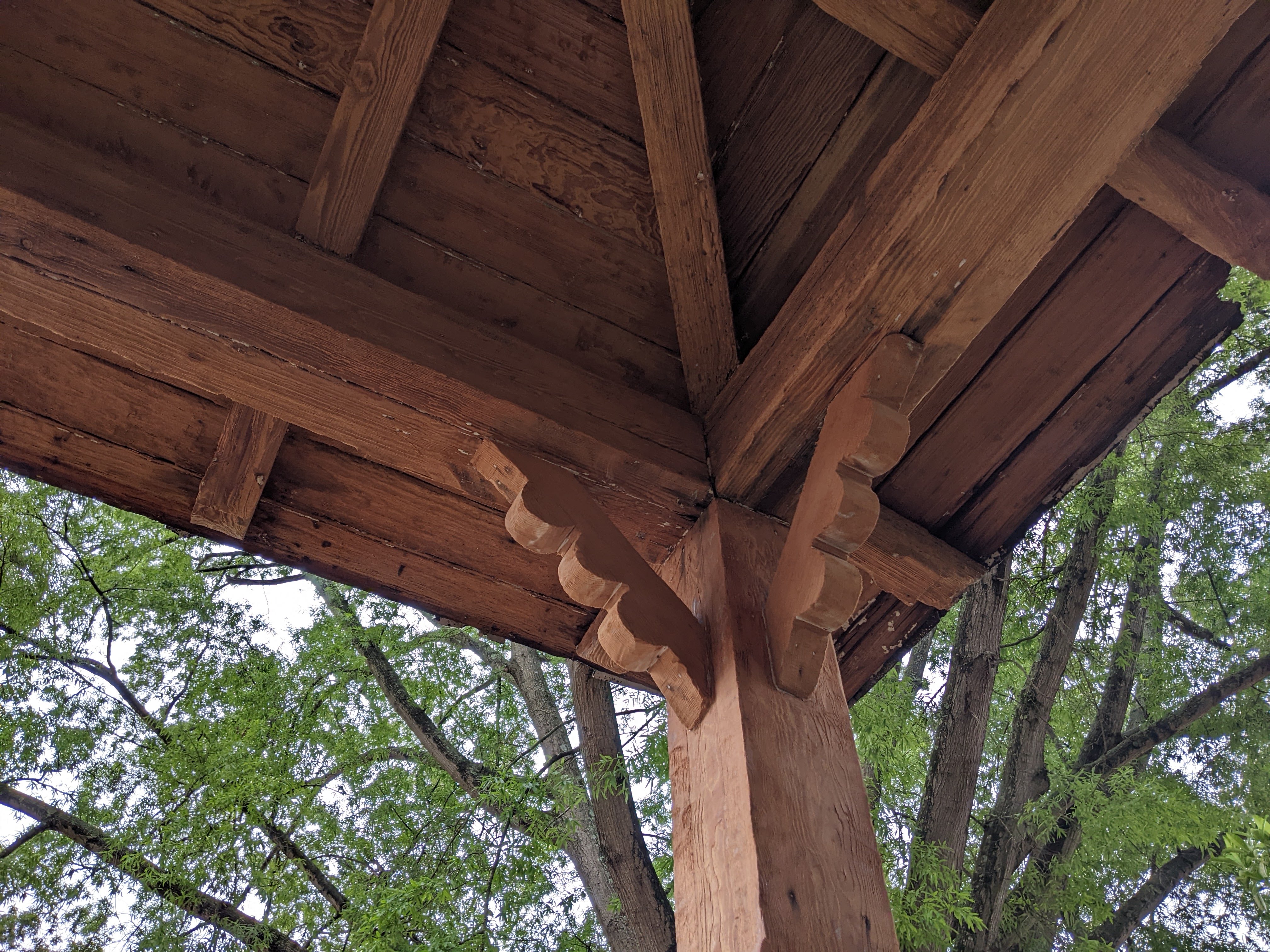 House of Mnay Porches front porch posts, brackets and rafters after abatement ca. 2023