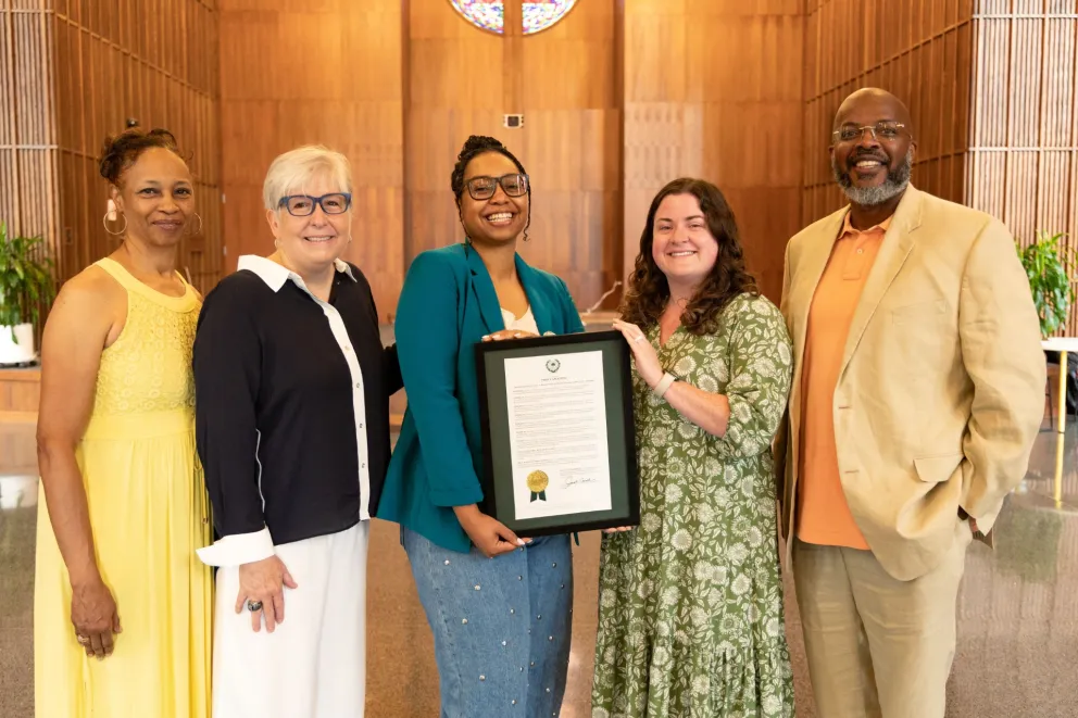 group of people with an award