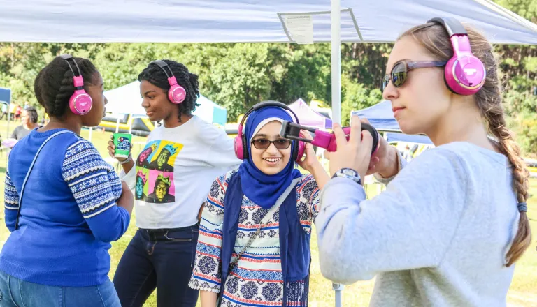 Teen girls at silent disco at Dix Park event