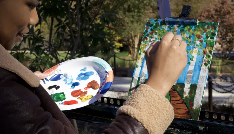 Painting outdoors during an art program at Dix Park