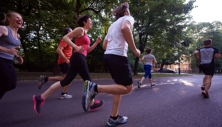 Group of people running in a park