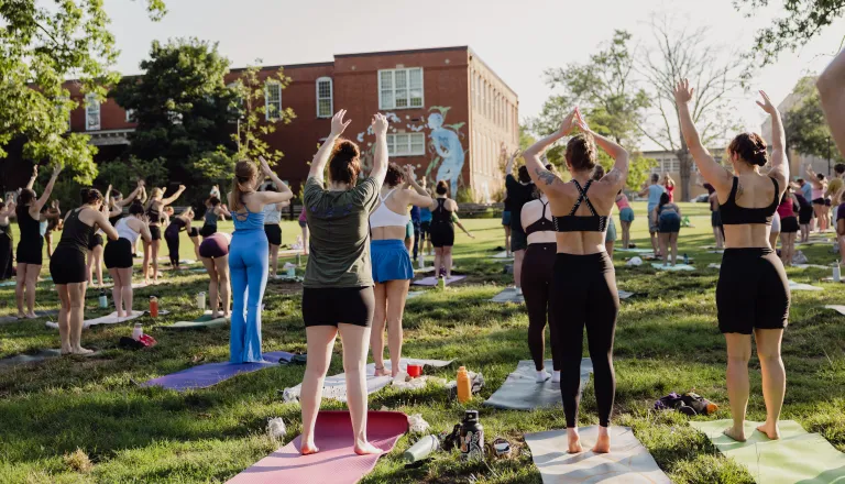 adults doing yoga