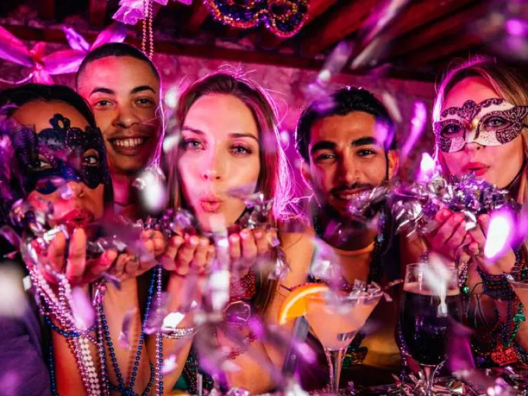 Mardi Gras masquerade party attendees  