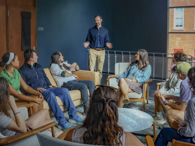 Group of people sitting in a circle