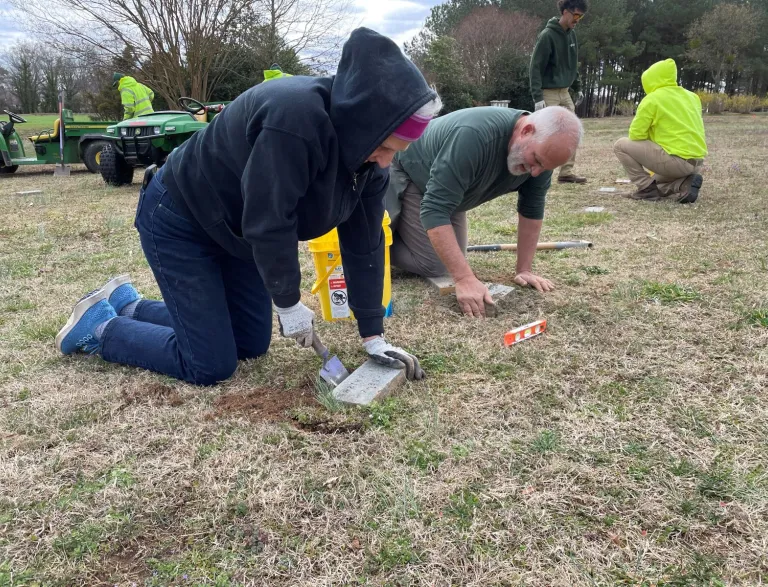 2024 Raleigh Parks Volunteers releveling cemetery markers