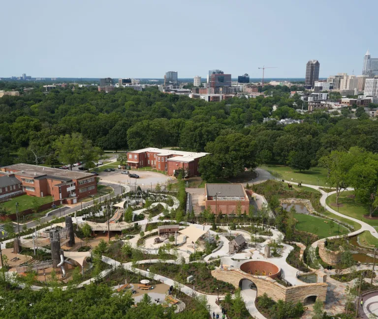 Gipson Play Plaza in Dix Park with the downtown Raleigh skyline